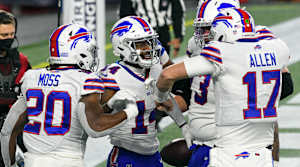 Buffalo Bills wide receiver Stefon Diggs celebrates with quarterback Josh Allen and running back Zack Moss after scoring a touchdown against the New England Patriots during the second half at Gillette Stadium.